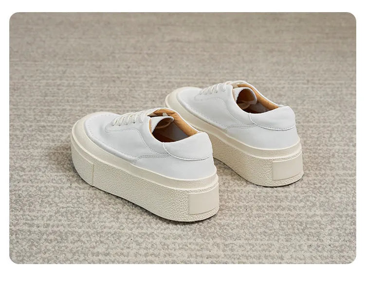 Women's black platform casual board shoes with embossed cowhide leather and round toe