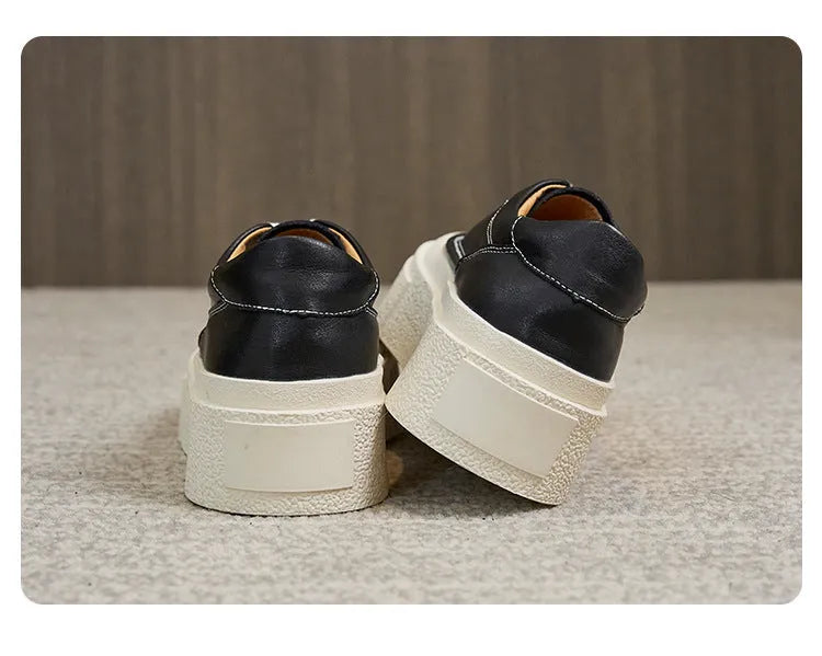 Women's black platform casual board shoes with embossed cowhide leather and round toe