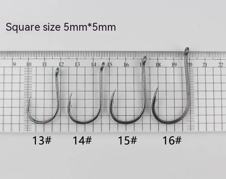 Bulk pack of barbed alloy carbon steel fishing hooks for rock and sea fishing in various sizes.