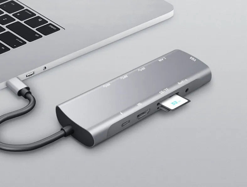 Grey aluminium USB-C docking station with HDMI, VGA, USB 3.0, and PD charging ports