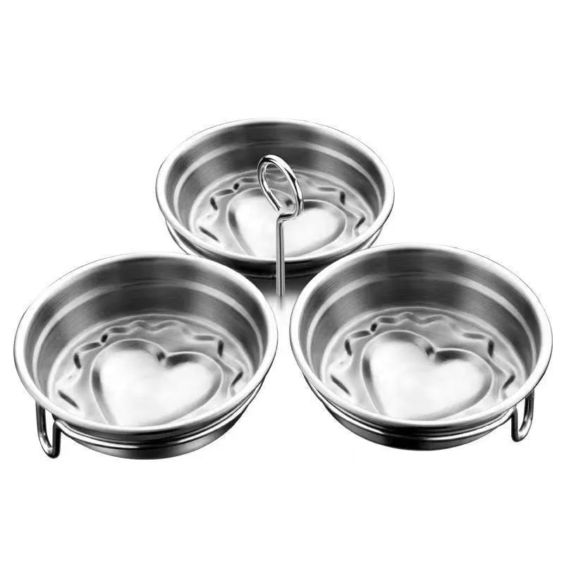 Stainless steel heart-shaped egg steamer with cooking wells for decorative boiled eggs