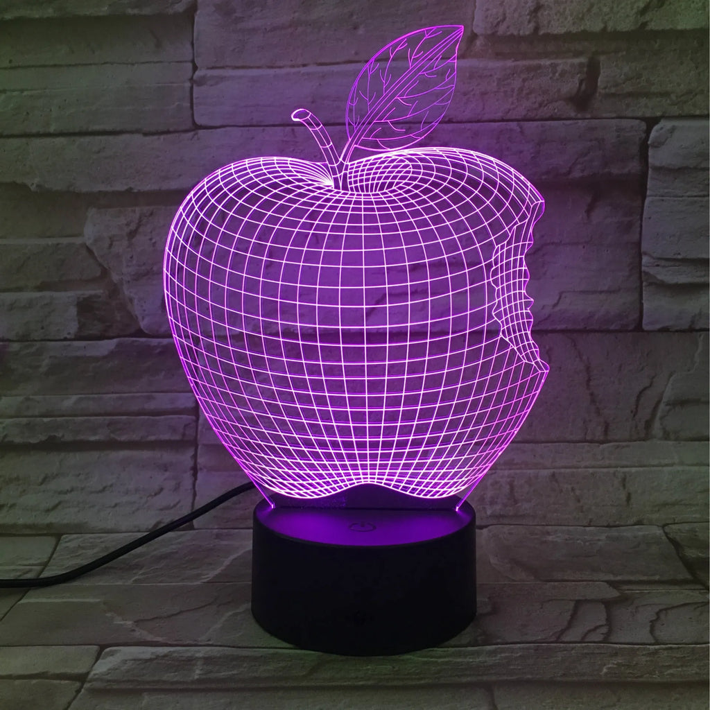 3D fruit-shaped decorative night light with colourful LED illumination on a table.