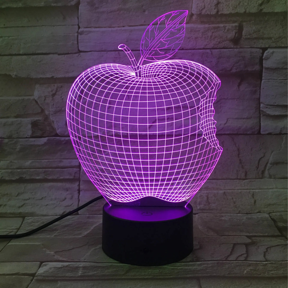 3D fruit-shaped decorative night light with colourful LED illumination on a table.