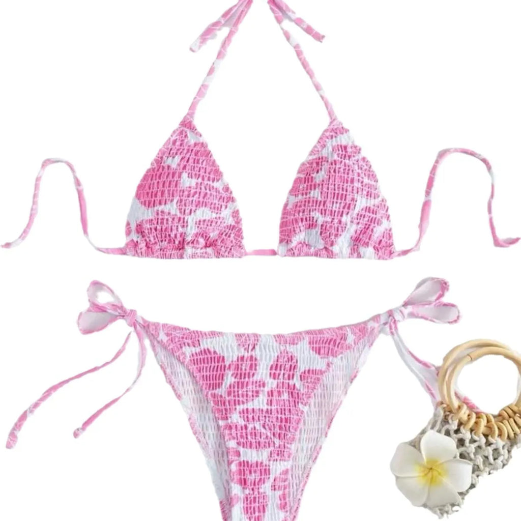Women's floral print halter bikini swimsuit in light blue colour on a mannequin.