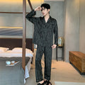 Men's black striped Ice Silk pajama set with long sleeves and trousers.