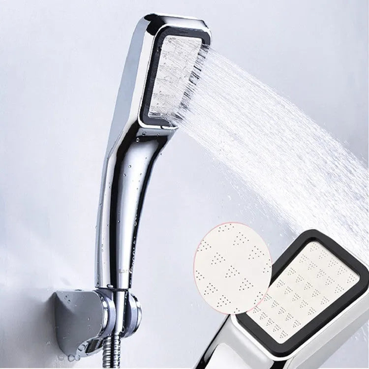 Orange hand-held pressurised shower with 60mm rain spray face