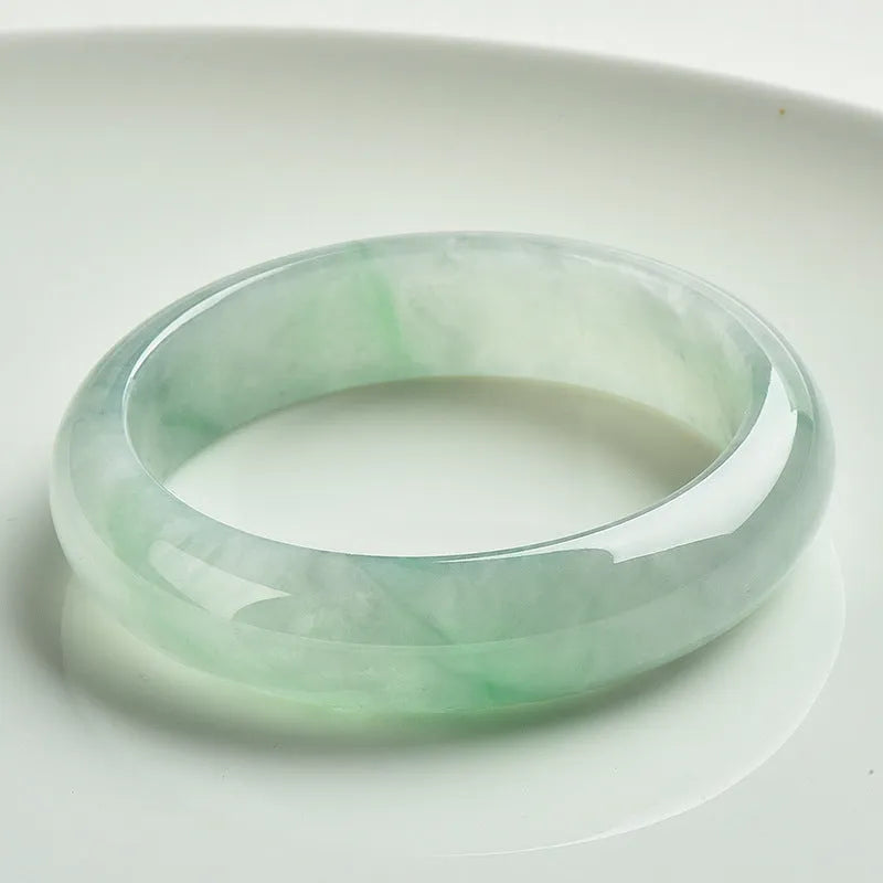 Light green jade bracelet with natural style design on wrist
