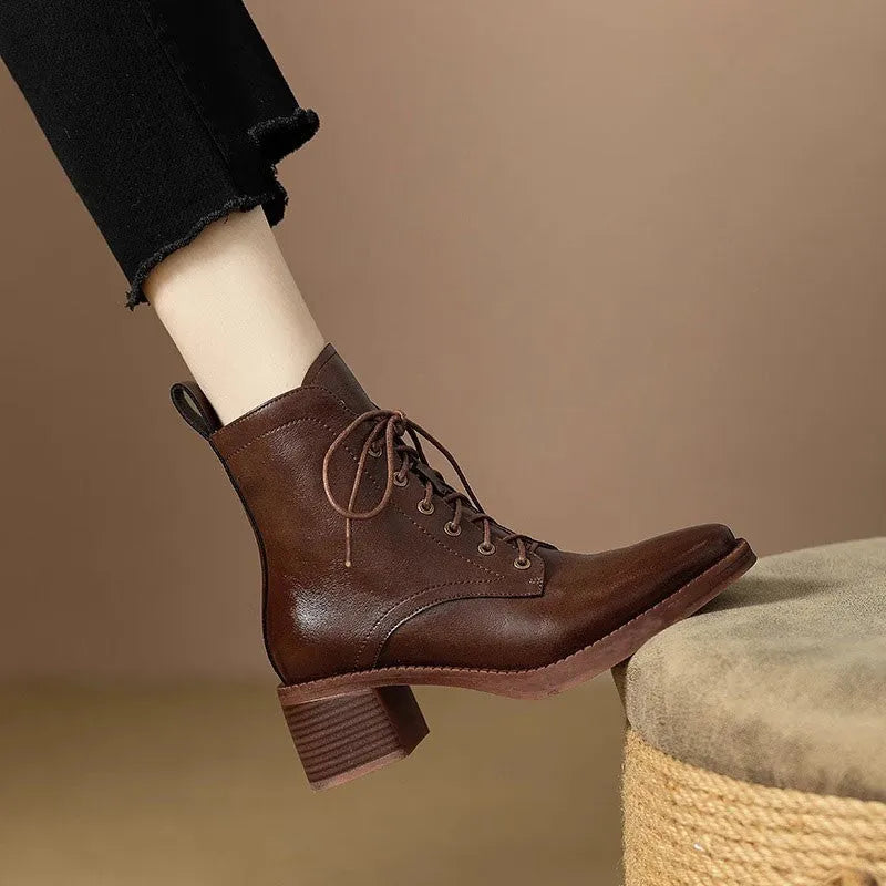 Women's black pointed-toe ankle boots with block heel and short shaft design