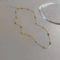 Gold alloy geometric necklace with a square colour artificial crystal pendant on a clavicle-length chain.