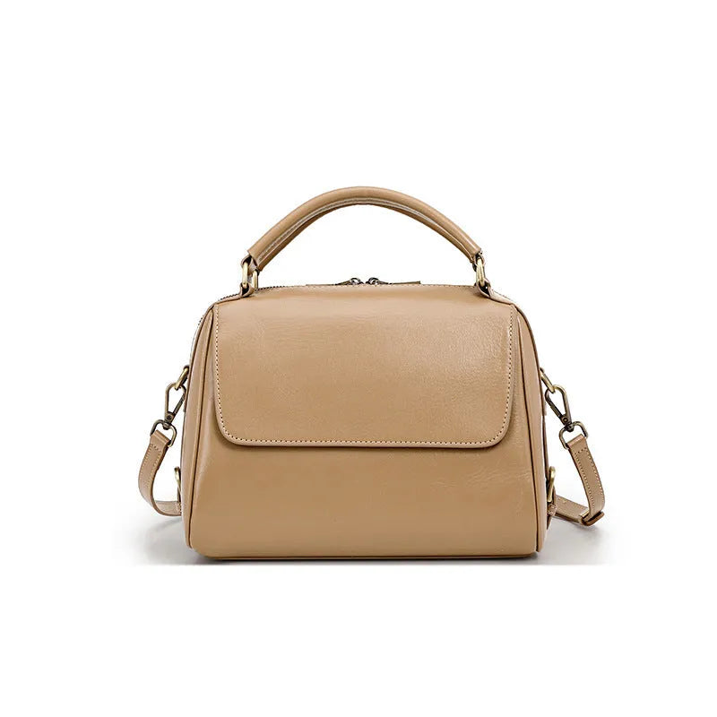 Women's genuine leather crossbody tote bag in apricot colour showing outer slit pocket and double shoulder straps