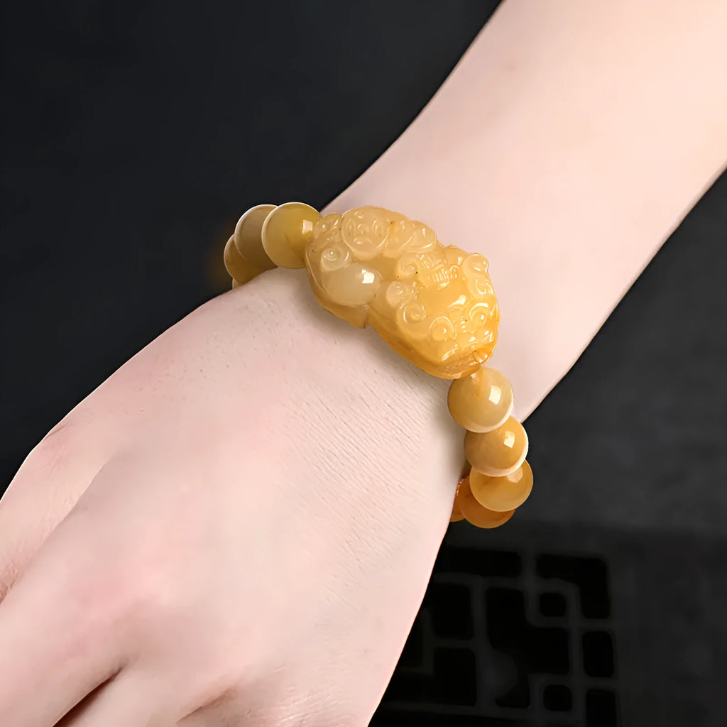 Hand-carved golden thread jade money coin bracelet with jade beads in two size options.