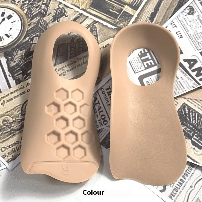 White arch support varus correction insole made from TPR material, shown next to a black and a skin colour version.
