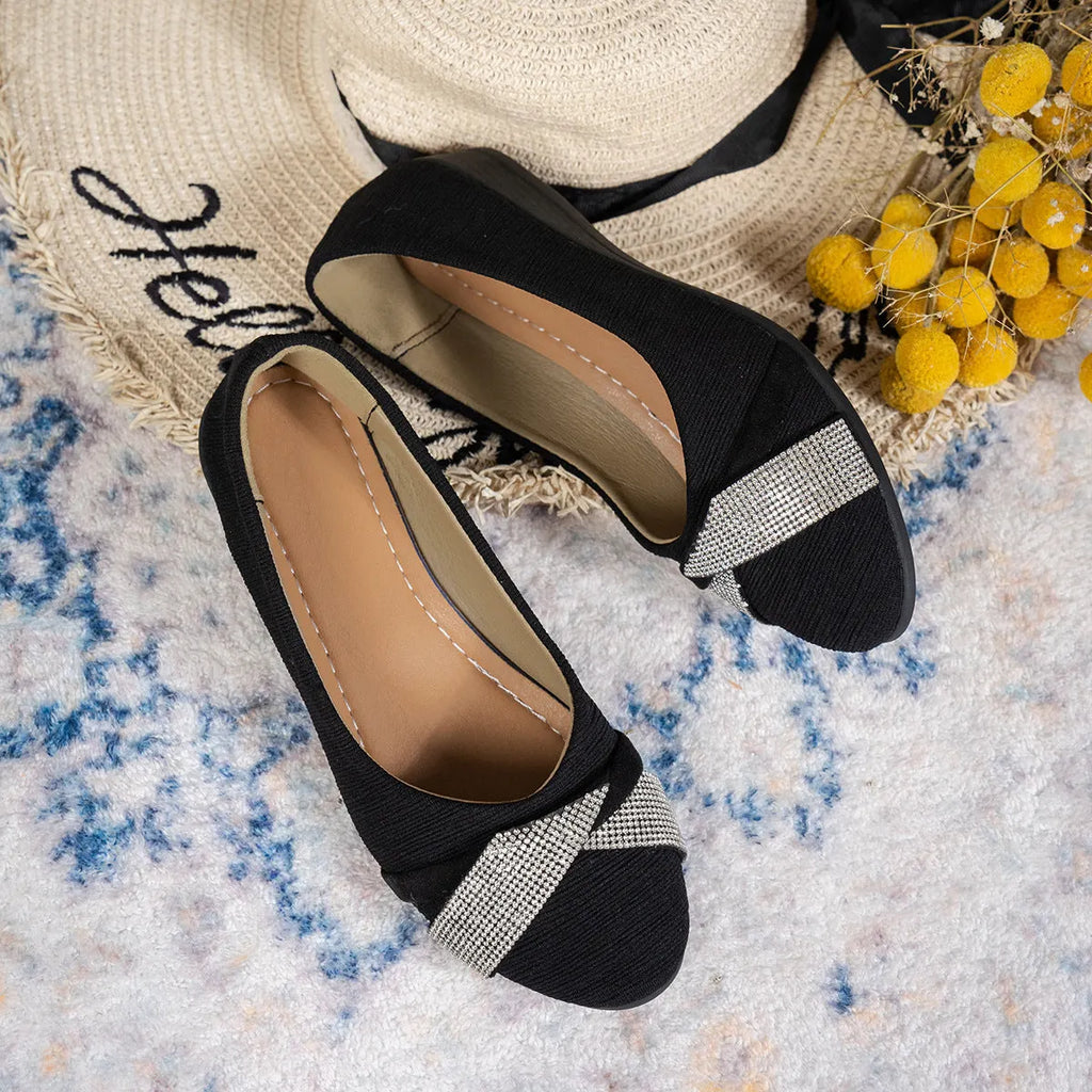 Black women's slip-on casual shoes with rhinestone decoration and a chunky heel.