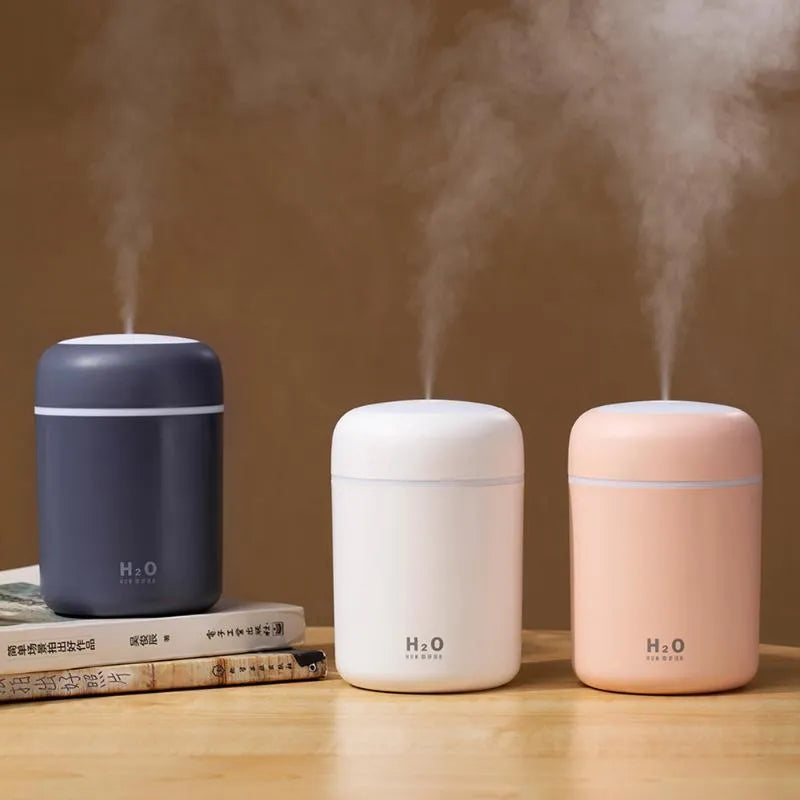 Pink USB desktop humidifier with mood lights and water tank