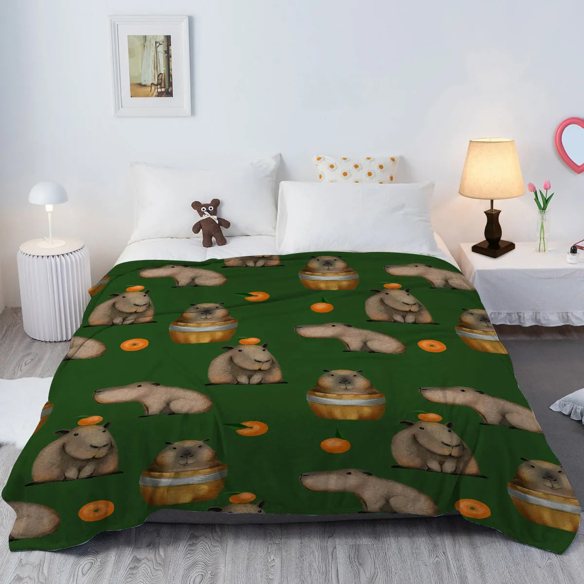 Flannel fleece blanket with orange capybara print, soft fluffy throw in three sizes with hemmed edges.