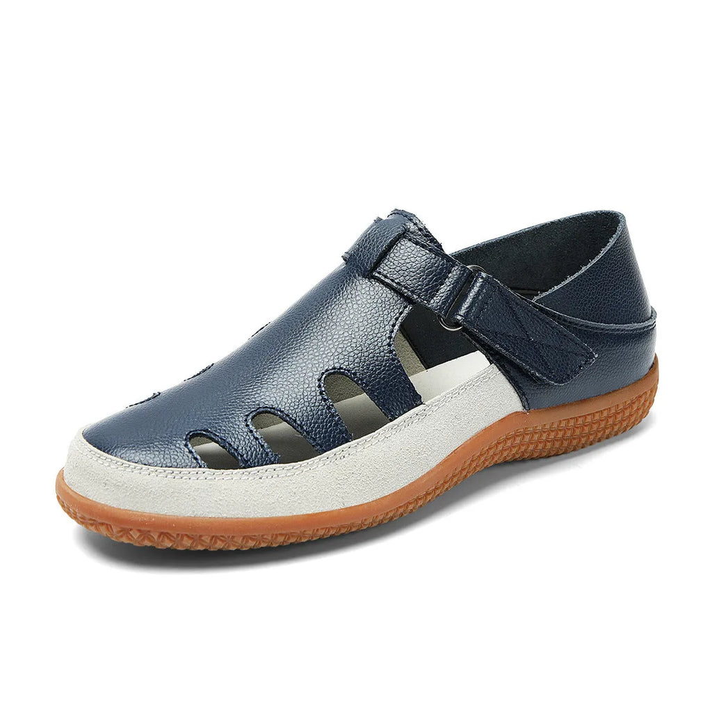 Plus size women's flat sandals in blue with a hollow toe cap and thick rubber sole.