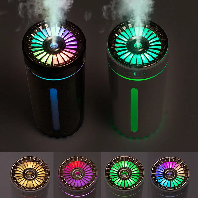 Black portable USB humidifier with colourful LED lights, shown next to a USB cable, suitable for car cup holders.