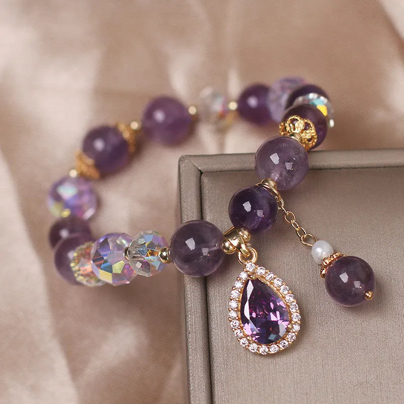 Close-up of a women's bracelet with natural purple amethyst stones set using micro inlay craftsmanship.