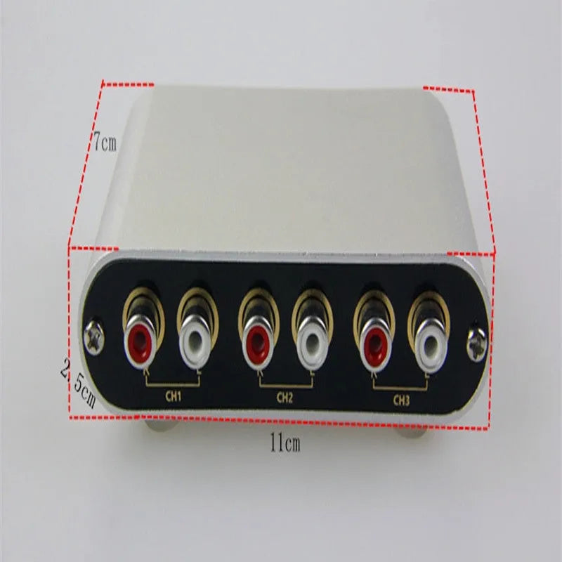 Silver aluminium audio source switch box with remote control for input/output selection.