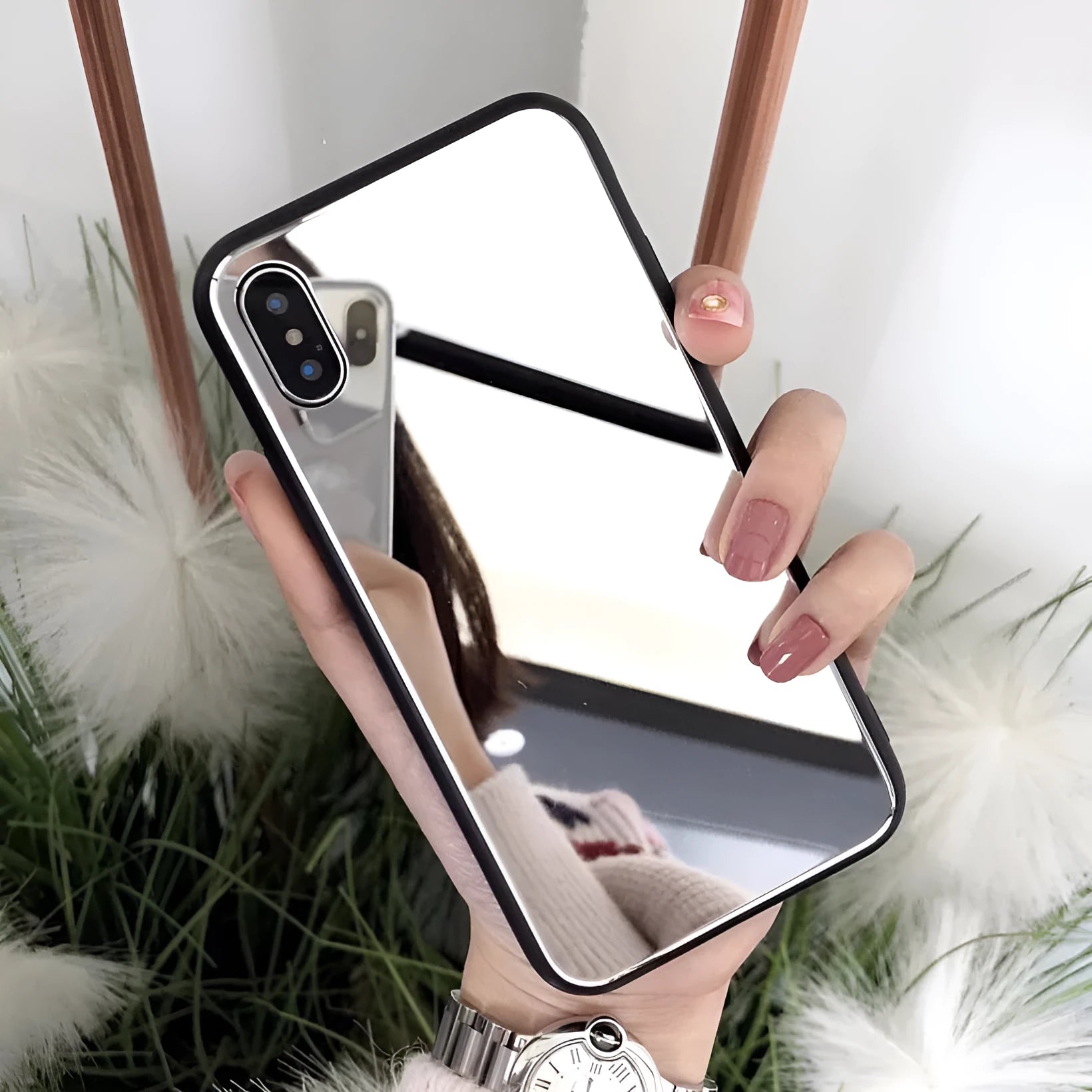 Black iPhone case with a reflective mirror surface on the back, compatible with iPhone X and iPhone 7/8 Plus models.