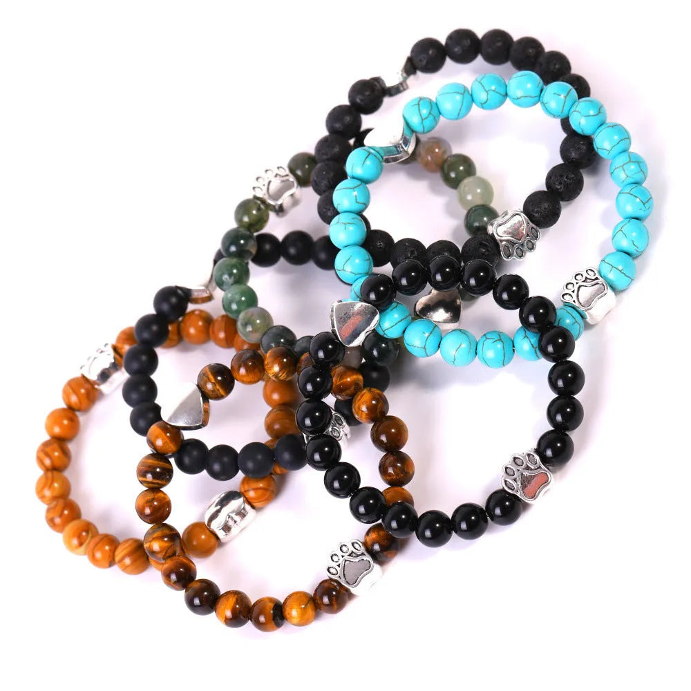 Tiger's Eye and Indian Agate stone beaded bracelet with a dog's paw charm on a white background.