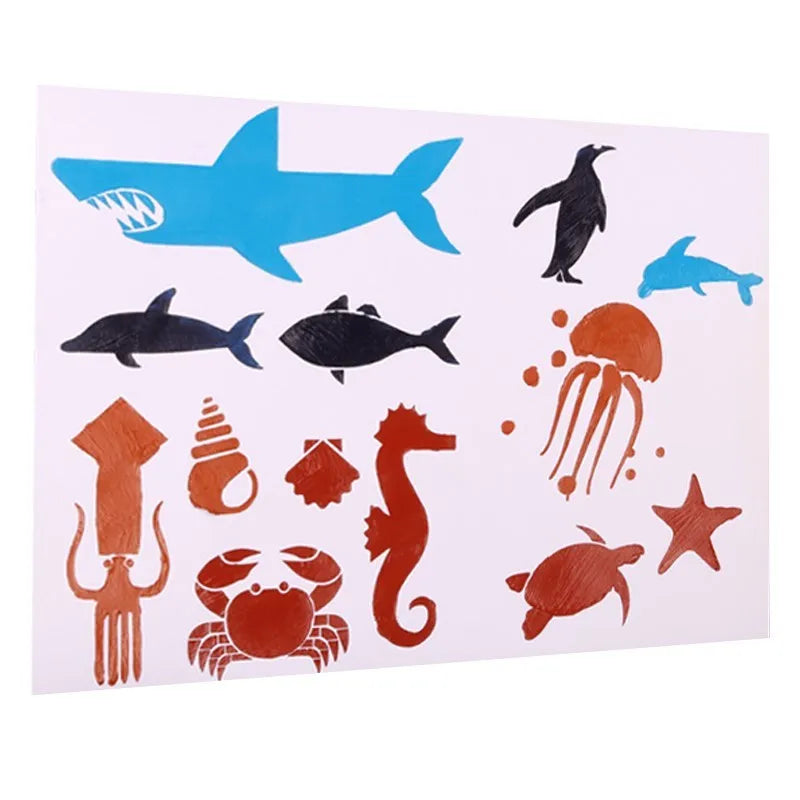 A set of white drawing stencils with various cut-out shapes, laid out on a flat surface.