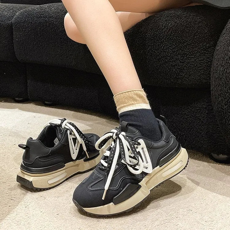 Women's retro platform sports shoes in black with artificial PU upper and rubber sole