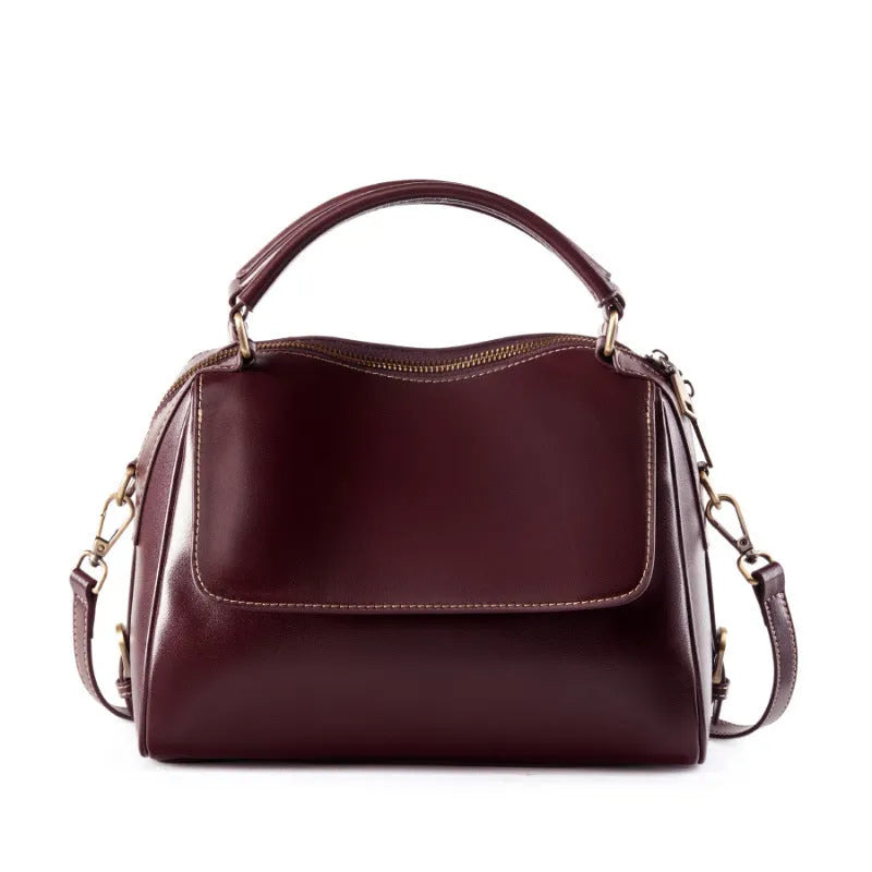 Women's genuine leather crossbody tote bag in apricot colour showing outer slit pocket and double shoulder straps