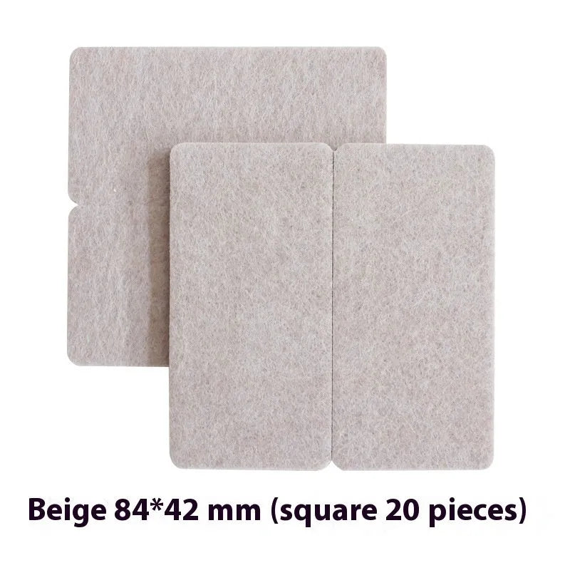 Assortment of beige plastic furniture leg protection pads in round and square sizes on wooden floor