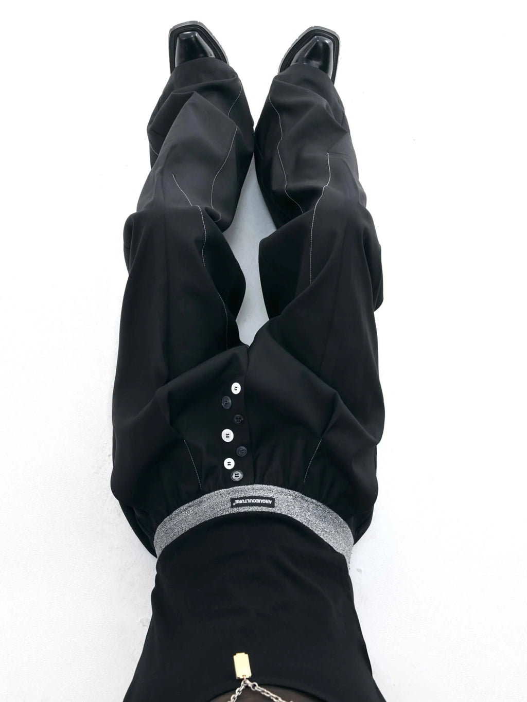 Straight-leg high-waist casual trousers in grey with a button-open line design detail on the leg.