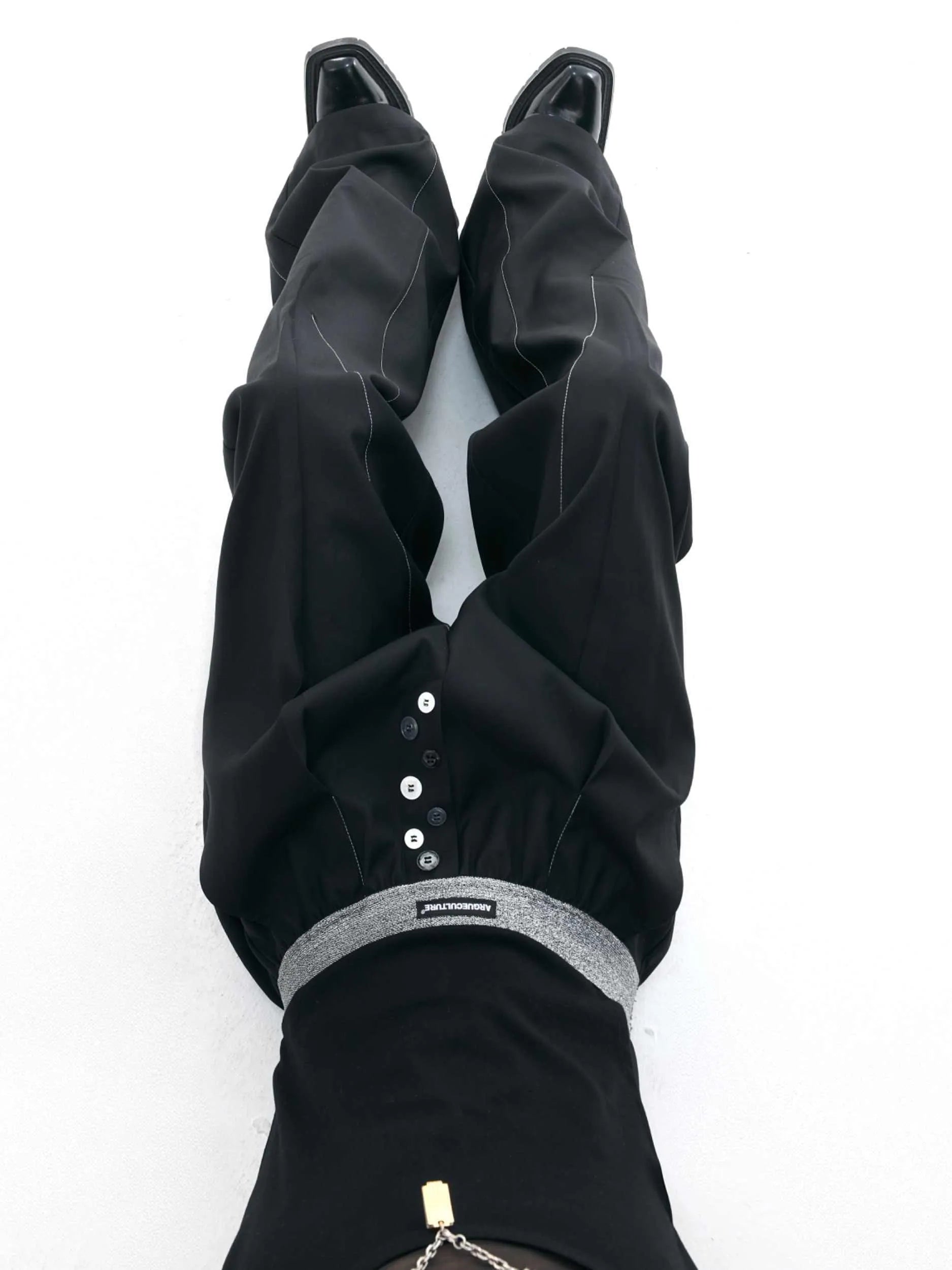 Straight-leg high-waist casual trousers in grey with a button-open line design detail on the leg.