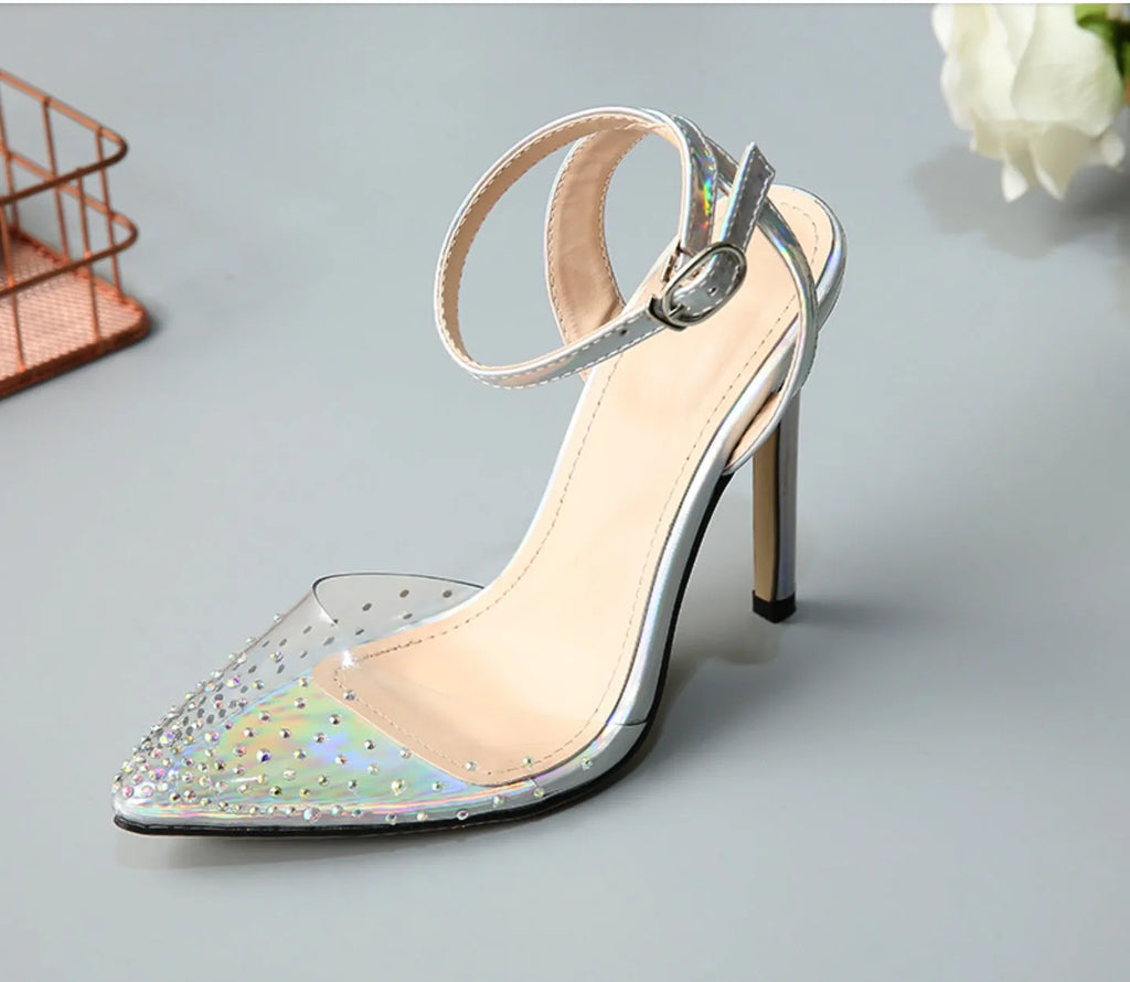 Women's pointed toe diamond sandals with stiletto heel and strappy PVC upper.