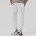 Men's grey casual track sweatpants with straight-leg design and mid waist, made from polyester blend elastic fabric