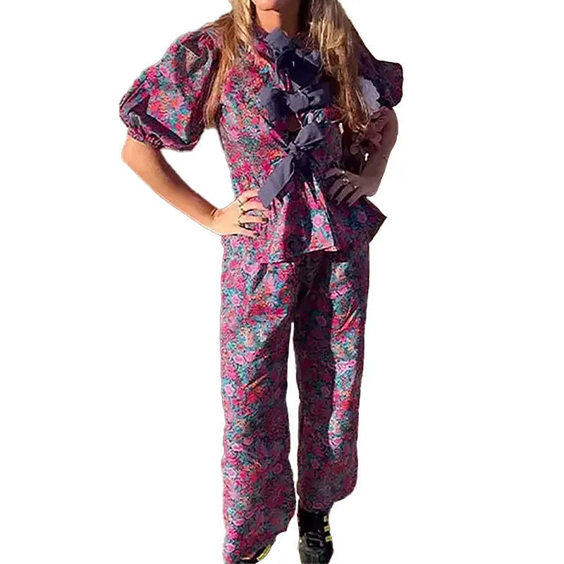 Women's floral print trousers suit set with tie-neck top and puff sleeves