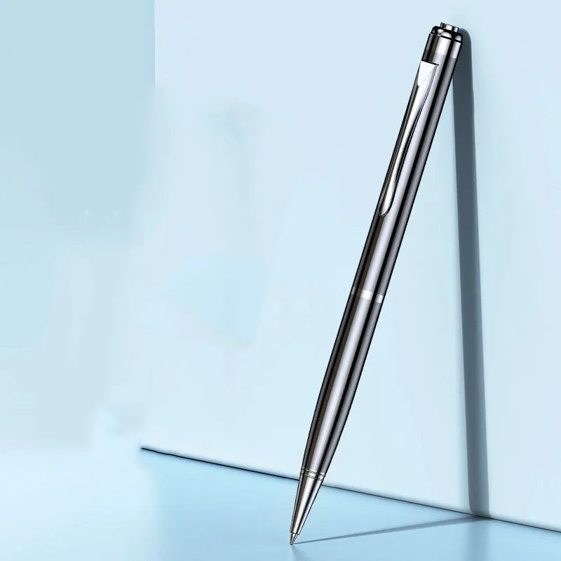 Black pen-shaped digital voice recorder with zinc alloy shell next to included headset and data cable.