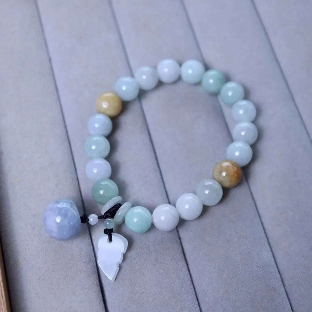 Natural jade bracelet with geometric pendant and hanging charms including Maitreya Buddha, gourd, and double apple designs
