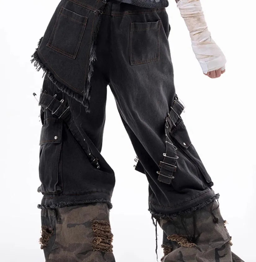 Grey camouflage men's jeans with panel splicing construction and ribbon detailing.