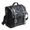 Black waterproof canvas motorcycle side pannier bag with cowhide detailing showing mounted position on bike