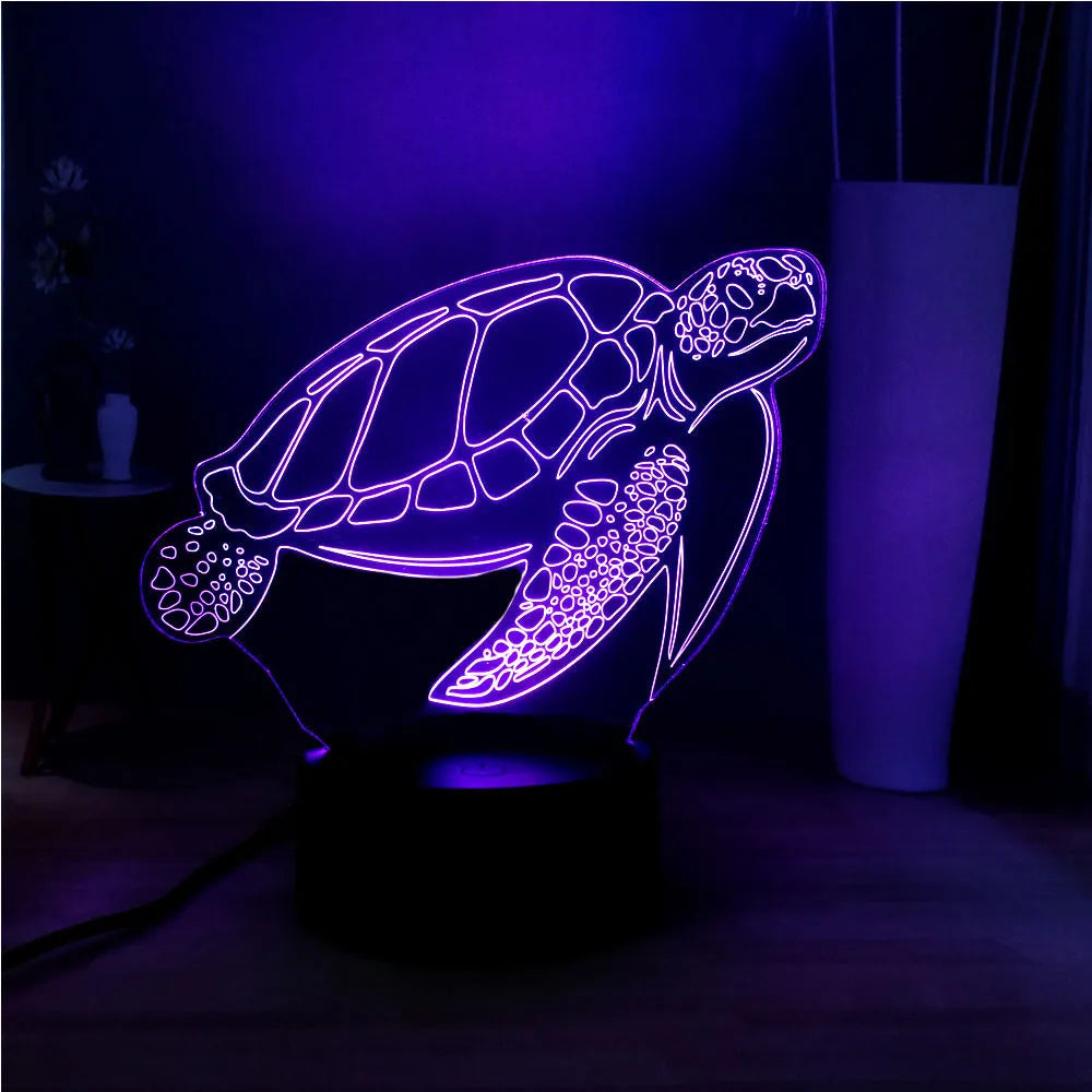 3D clear acrylic turtle-shaped LED night light showing colour changing illumination.