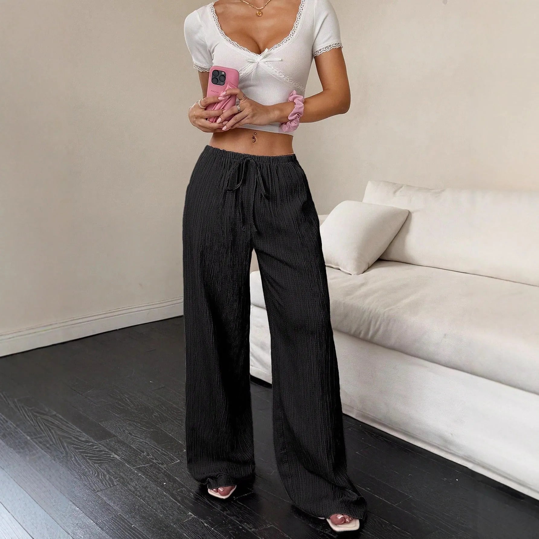 Women's black wide-leg trousers with lace-up waist trimming detail