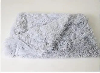 Soft long plush dog blanket in dark grey, sizes S M L shown next to a large dog.