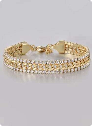 Gold-coloured titanium steel tennis bracelet with inlaid artificial gemstones on a wrist.