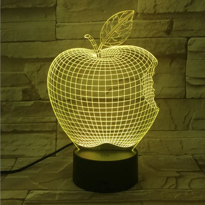 3D fruit-shaped decorative night light with colourful LED illumination on a table.