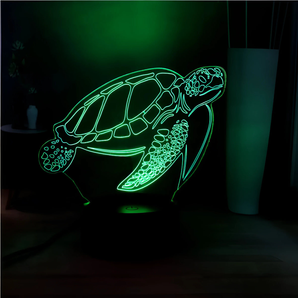 3D clear acrylic turtle-shaped LED night light showing colour changing illumination.