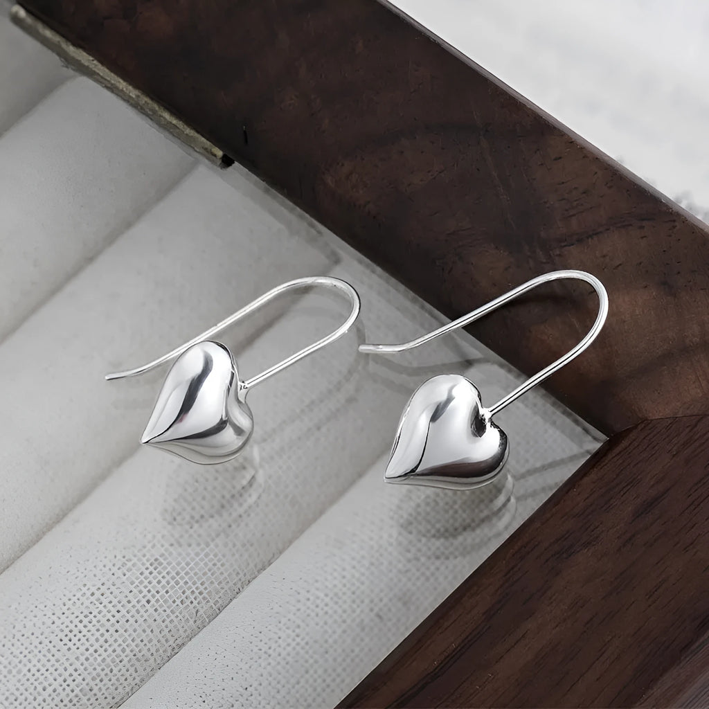 Korean style 3D heart-shaped earrings with glossy finish and silver colour
