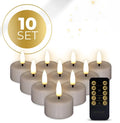 Four taupe-coloured LED tealight candles with 3D flickering flame effect on a surface.
