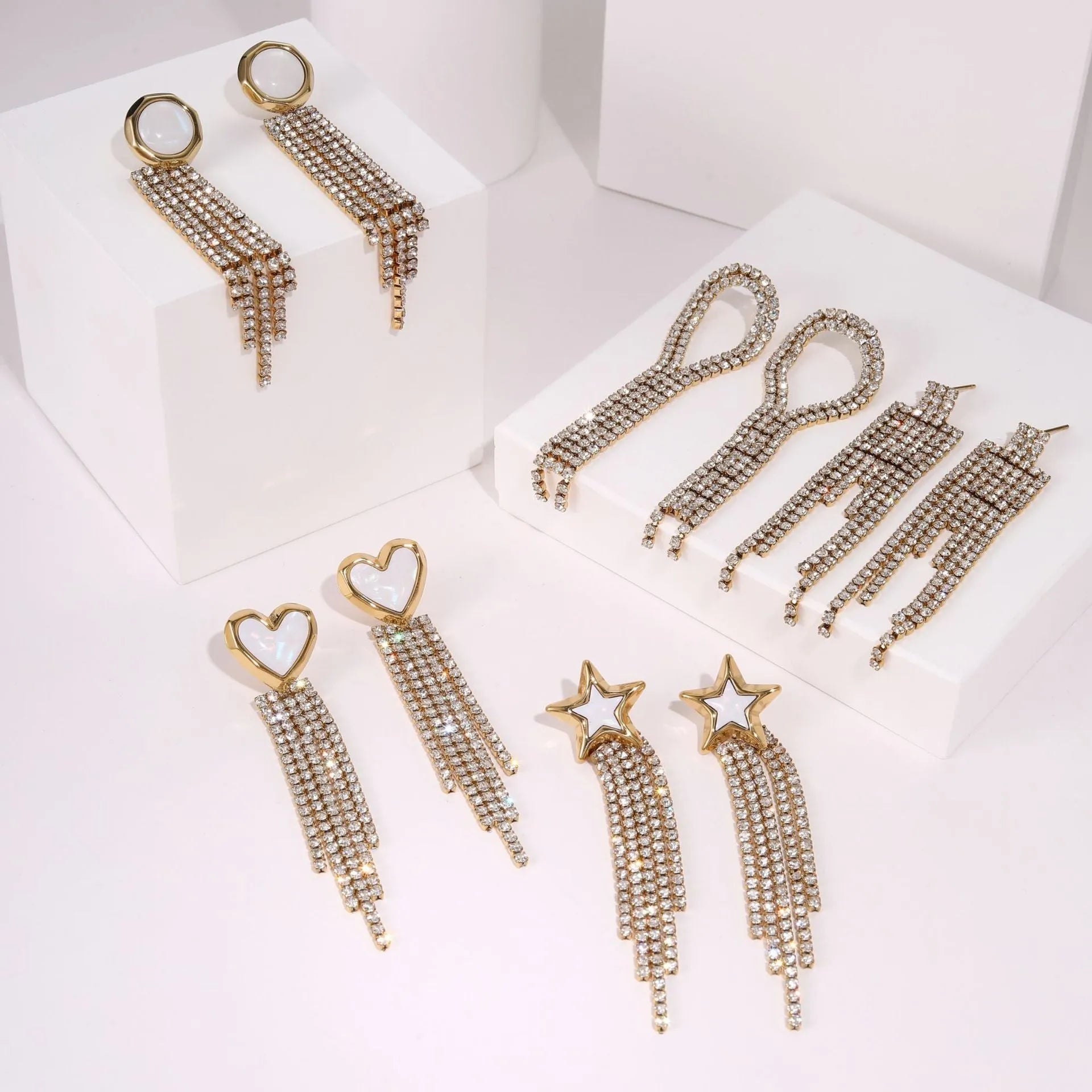 Stainless steel earrings with diamond tassel designs featuring love heart and star geometric shapes