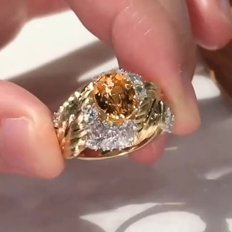 Gold-colour copper women's ring with embossed feather pattern and yellow zircon stone