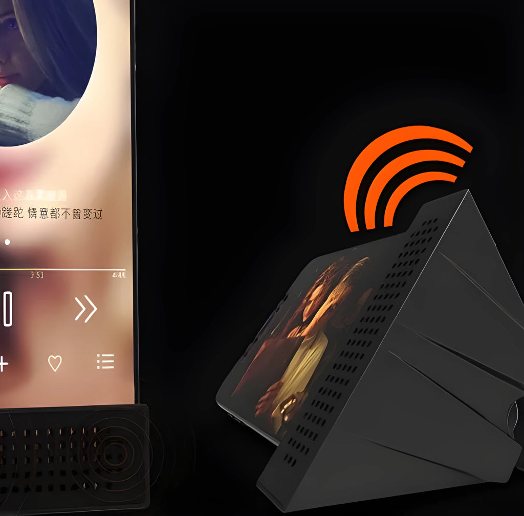 Mini black ABS plastic mobile phone amplifier bracket holding a smartphone on a desktop.