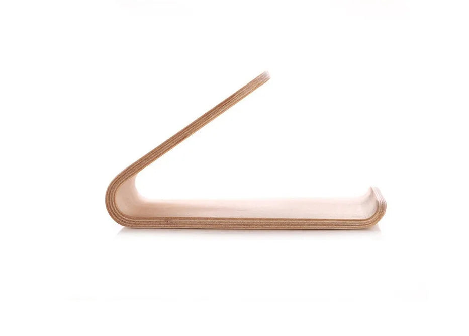 Minimalist wooden phone stand for Apple iPhone in walnut finish on a desk.